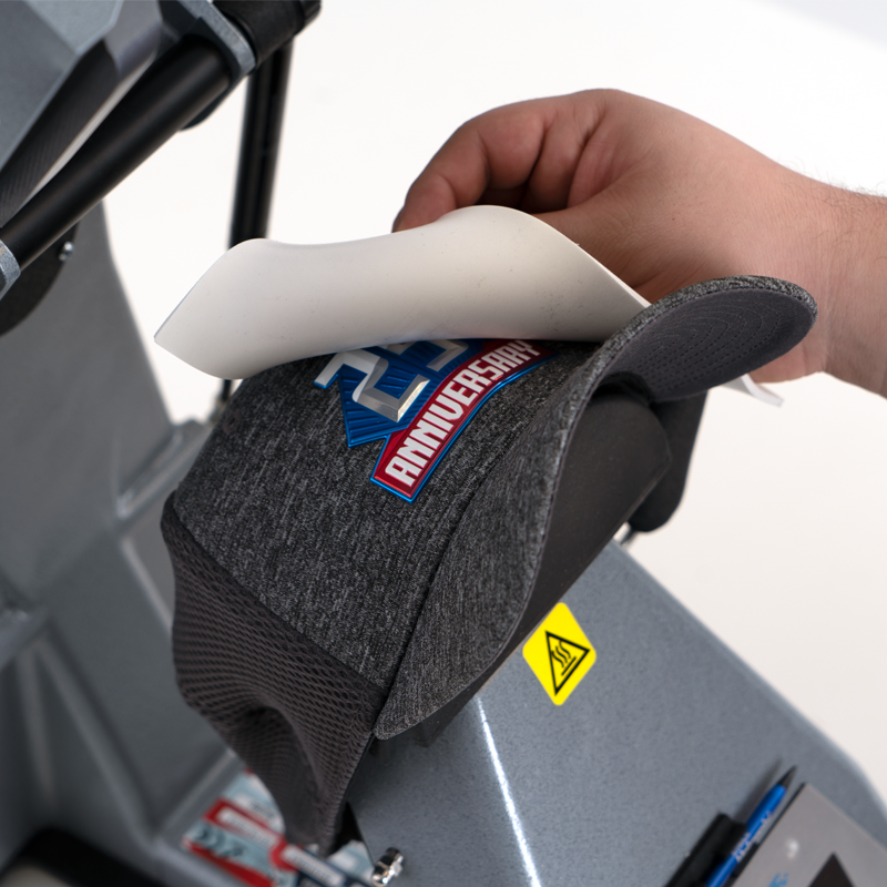 close up of hotronix white cover pad on a hat heat press